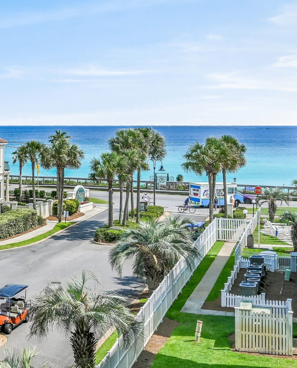 Palm trees, green lawns and the emerald Gulf seen from Maravilla in Destin, Florida